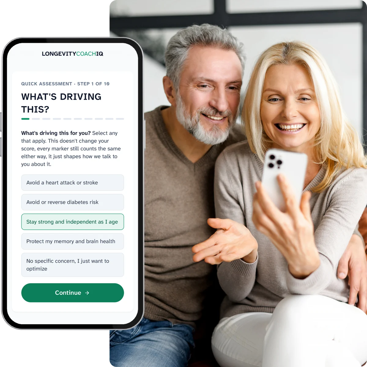A couple in their fifties sitting together, looking at the quick assessment on a phone. The screen asks what is driving their interest in longevity, with staying strong and independent selected.